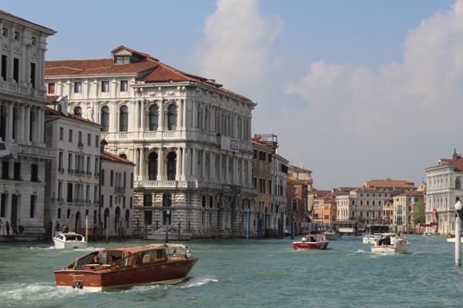 Venice Grand Canal with boats and historic buildings in springtime, Italian spring travel with Ethiopian Airlines.