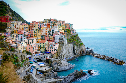 Cinque Terre colorful cliffside village overlooking the Ligurian Sea in Italy during spring, Ethiopian Airlines travel.