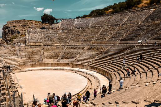 Visitors exploring an ancient amphitheater in summer London travel highlights, Ethiopian Airlines blog.”