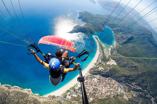 Paragliding above Turkey’s blue lagoon in Ölüdeniz during autumn, a thrilling escape with Ethiopian Airlines.